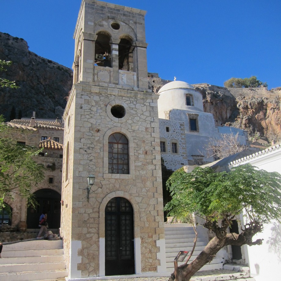 A church sitting on a rock